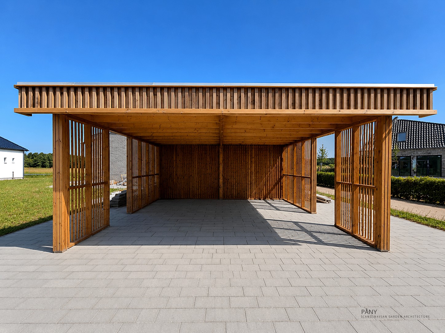 Finished PÅNY double carport with shed in a Danish garden — daylight, timber detail and greenery